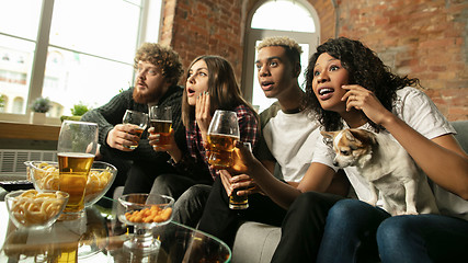 Image showing Excited group of people watching sport match, championship at home