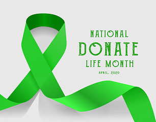 Image showing National donate life month. Vector illustration with green ribbon on light