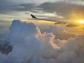 Image showing sunset over the clouds