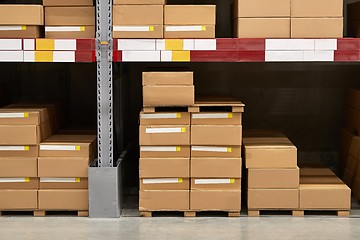 Image showing Warehouse stocked with boxes in stacks