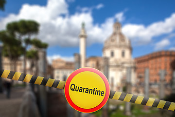 Image showing Warning sign of quarantine on the blurred background of Rome City, Italy.