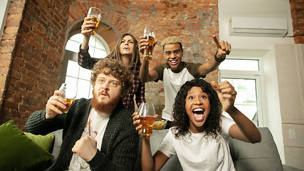 Image showing Excited group of people watching sport match, championship at home