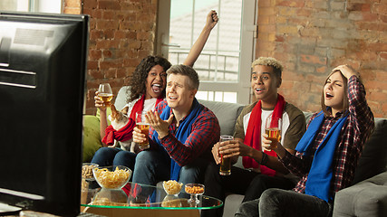 Image showing Excited group of people watching sport match, championship at home