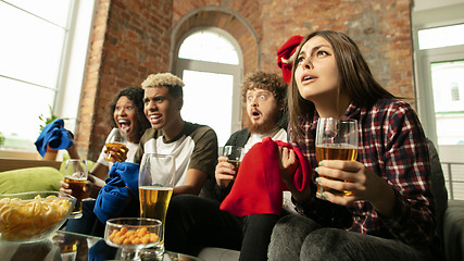 Image showing Excited group of people watching sport match, championship at home