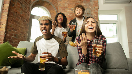 Image showing Excited group of people watching sport match, championship at home