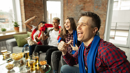 Image showing Excited group of people watching sport match, championship at home