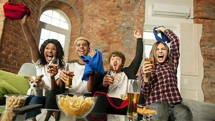 Image showing Excited group of people watching sport match, championship at home