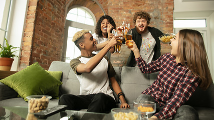 Image showing Excited group of people watching sport match, championship at home