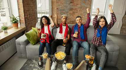 Image showing Excited group of people watching sport match, championship at home