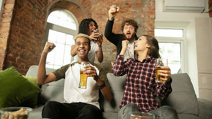 Image showing Excited group of people watching sport match, championship at home