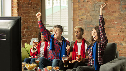 Image showing Excited group of people watching sport match, championship at home