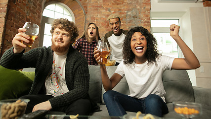 Image showing Excited group of people watching sport match, championship at home