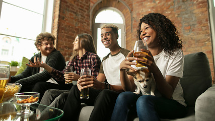 Image showing Excited group of people watching sport match, championship at home