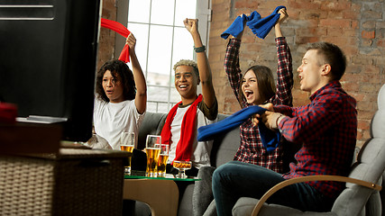 Image showing Excited group of people watching sport match, championship at home