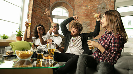 Image showing Excited group of people watching sport match, championship at home