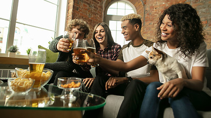 Image showing Excited group of people watching sport match, championship at home