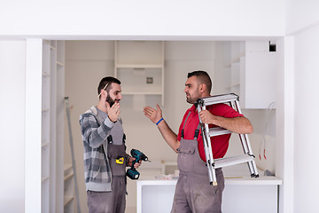 Image showing workers giving high five to each other