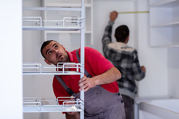 Image showing workers installing a new kitchen