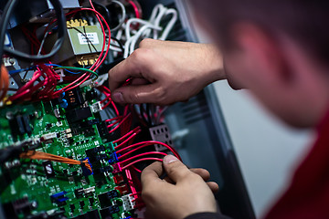 Image showing electrician engineer working with electric cable wires