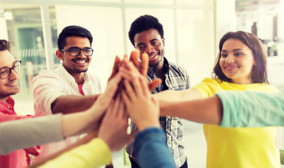 Image showing group of international students making high five