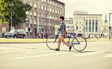 Image showing young man with fixed gear bicycle on crosswalk