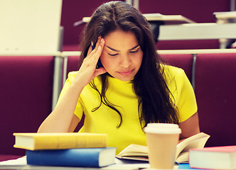 Image showing student girl with books and coffee on lecture