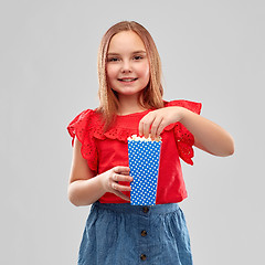 Image showing beautiful smiling girl in red shirt and skirt