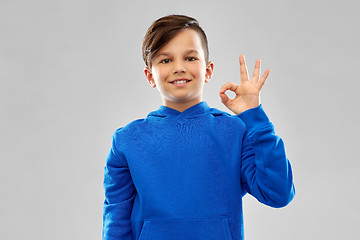 Image showing boy in blue hoodie showing ok hand sign