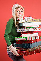 Image showing Caucasian girl with gifts on holiday