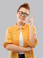 Image showing smiling red haired teenage student girl in glasses