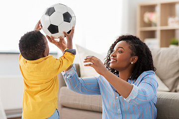 Image showing mother and baby playing with soccer ball at home