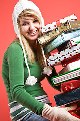 Image showing Caucasian girl with gifts on holiday