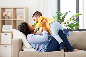 Image showing happy african american mother with baby at home