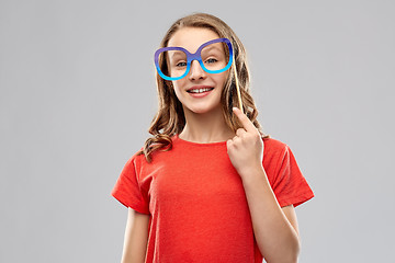 Image showing smiling teenage girl with party glasses