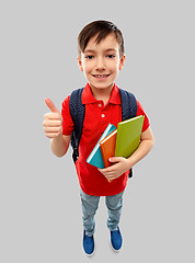 Image showing student boy with books and bag showing thumbs up