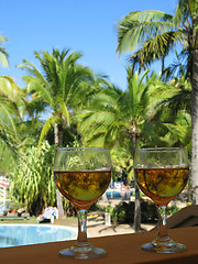 Image showing beer glasses in a tropical environment