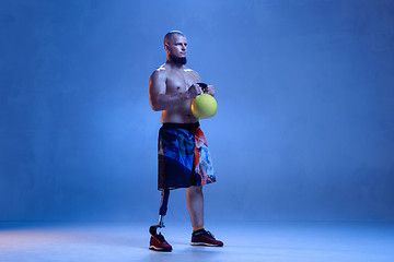 Image showing Athlete disabled amputee isolated on blue studio background