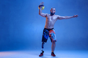 Image showing Athlete disabled amputee isolated on blue studio background