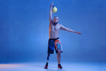 Image showing Athlete disabled amputee isolated on blue studio background