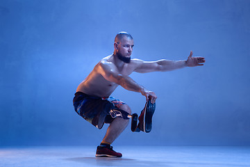 Image showing Athlete disabled amputee isolated on blue studio background