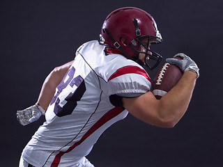 Image showing American football Player running with the ball