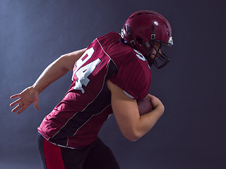 Image showing American football Player running with the ball