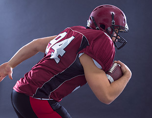 Image showing American football Player running with the ball