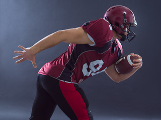 Image showing American football Player running with the ball