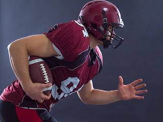 Image showing American football Player running with the ball