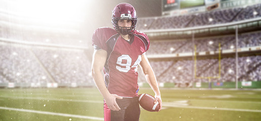 Image showing American Football Player isolated on big modern stadium field