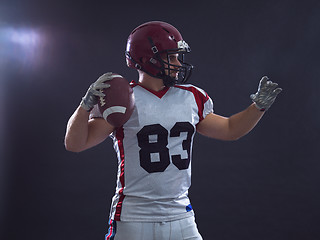 Image showing american football player throwing ball