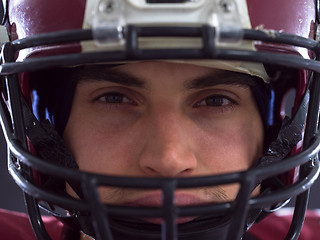 Image showing closeup American Football Player isolated on gray