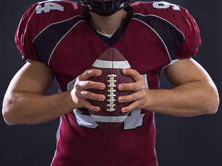 Image showing closeup American Football Player isolated on gray