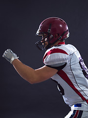 Image showing American football Player running with the ball